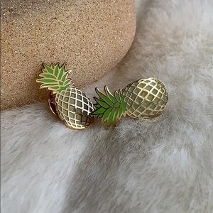 Two gold pineapple pins
